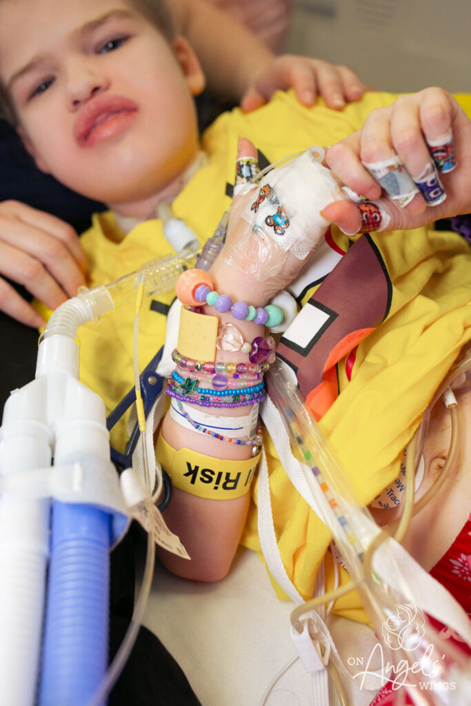a person with bracelets on their arm
